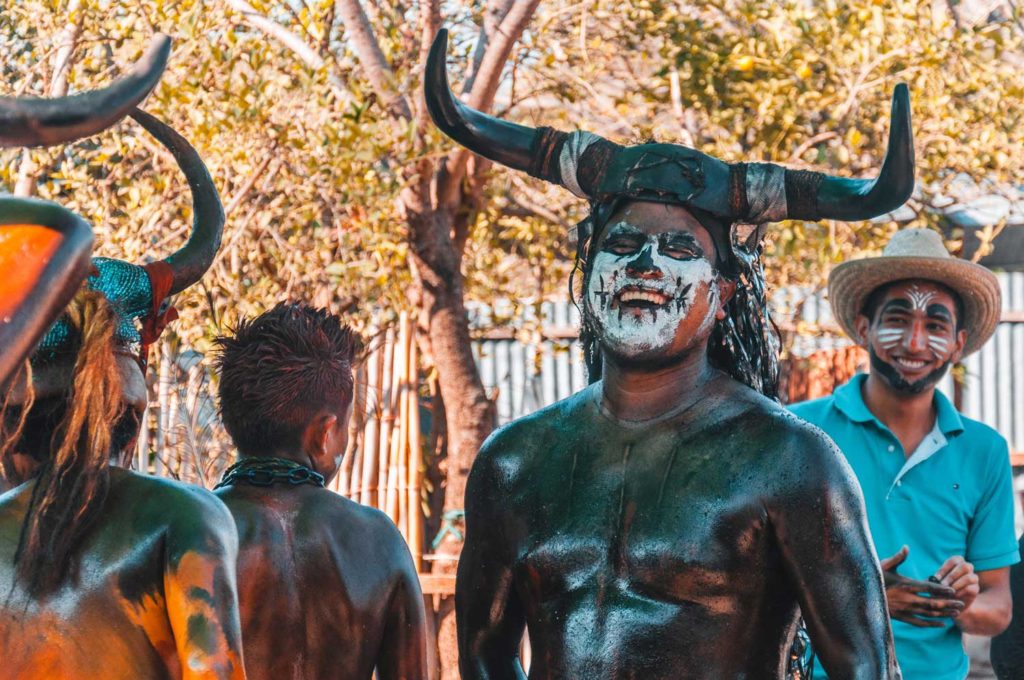 Mexican Man Wearing Demon Make Up & Bull Horns & Laughing