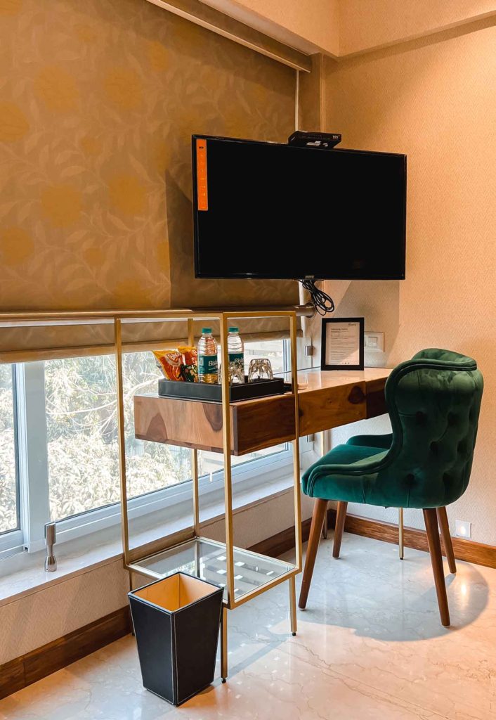 Room with Vintage Green Chair and Golden Desk in Theory9, A Boutique Stay in Mumbai