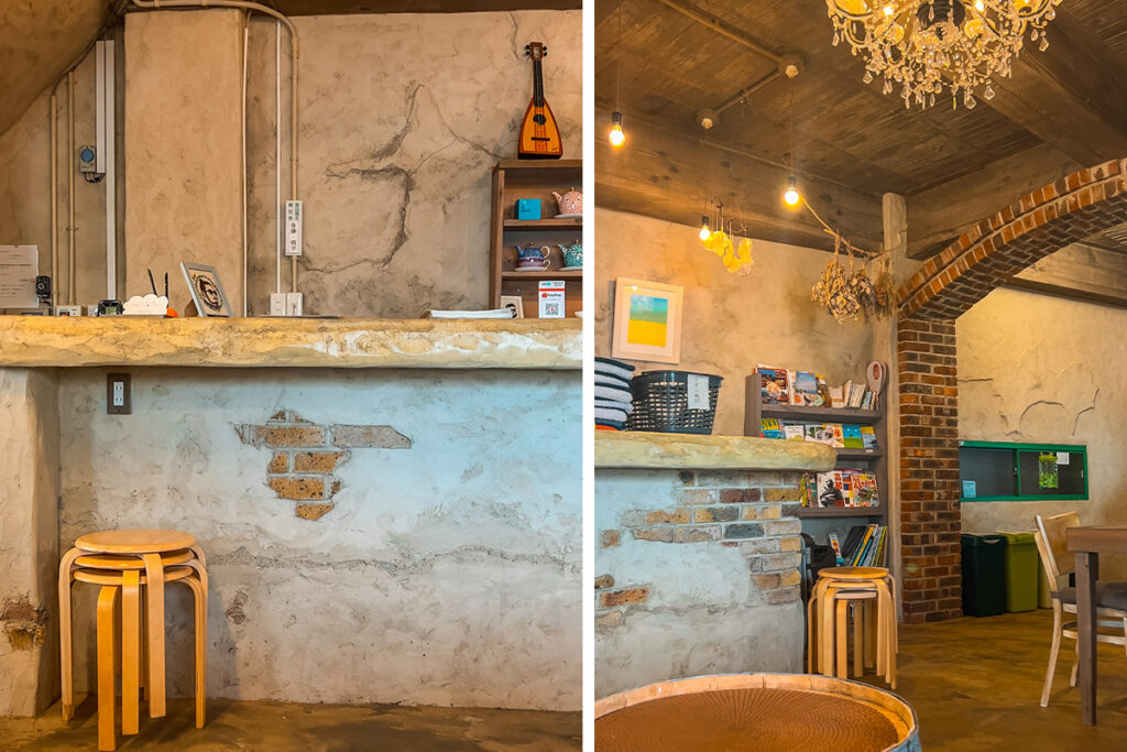 Lobby area of Cinnamon Guesthouse with chandelier on the ceiling and a bookcase in the corner.