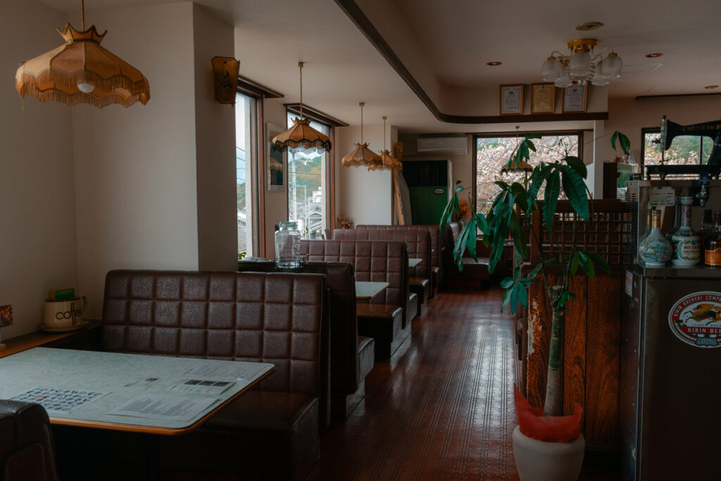 Leather seats and retro lamps of guesthouse Popeye in Iyo