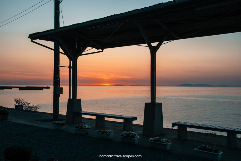 Sun setting in front of Shimonada train station in Ehime, Japan