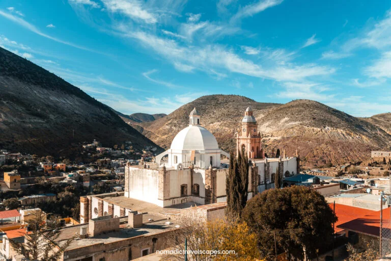 View of Iglesia Real de Catorce on a sunny day with blue skies, taken from the rooftop of a hotel